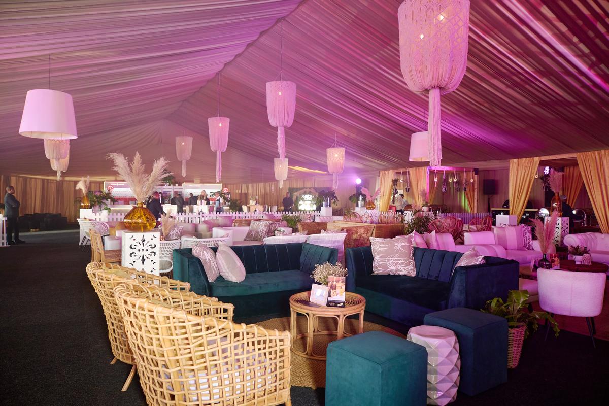 Marquee interior with chandeliers and lounge furniture
